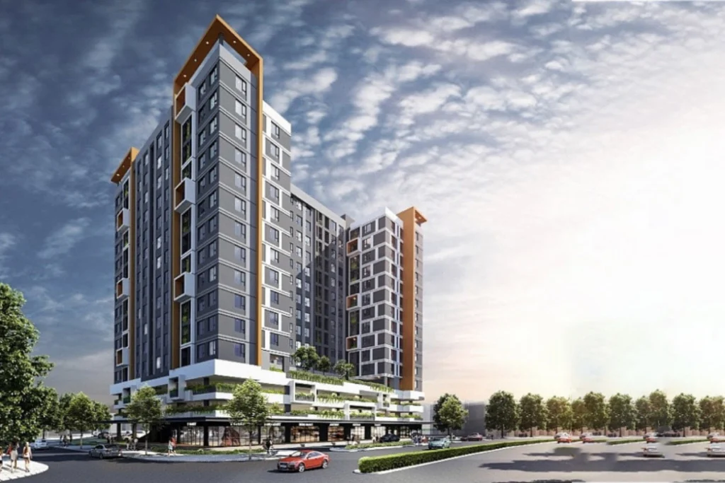 Phối cảnh góc nhìn nghiêng từ dưới đường phố hướng lên một khối tòa nhà chung cư cao tầng có kiến trúc zíc-zắc hiện đại đan xen tông màu ghi xám và trắng