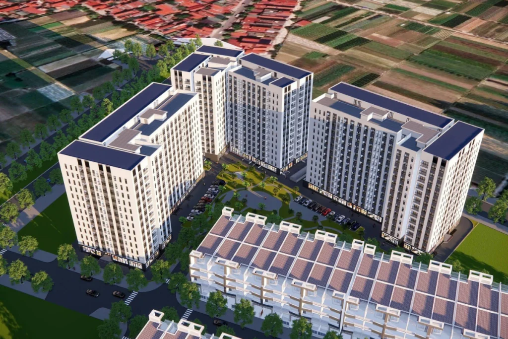 Ảnh phối cảnh 3D góc nhìn từ trên cao của một tổ hợp chung cư cao tầng hiện đại bao gồm các tòa tháp sơn màu trắng xám bao quanh một khuôn viên nội khu có công viên cây xanh