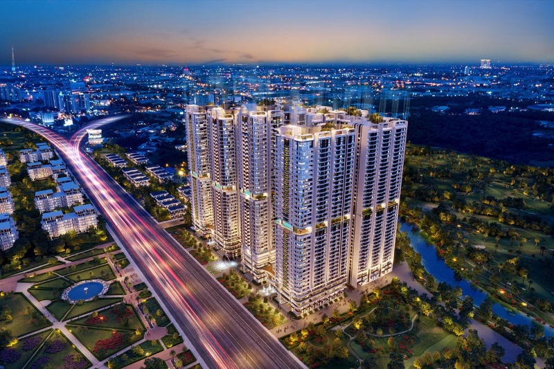 Phối cảnh tổng thể từ trên cao khu phức hợp căn hộ hạng sang Astral City Thuận An rực rỡ ánh đèn về đêm nằm ngay mặt tiền quốc lộ lớn tại Bình Dương