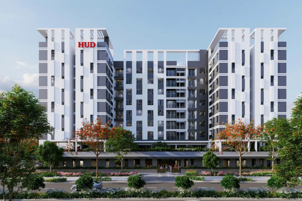 Bản vẽ phối cảnh tòa nhà chung cư hiện đại có logo HUD màu đỏ nổi bật của dự án nhà ở xã hội