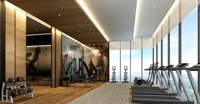 Phòng gym hiện đại với dàn máy chạy bộ hướng kính nhìn ra view sông và mảng xanh tại căn hộ cao cấp The Nassim Thảo Điền Quận 2