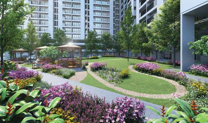 Khuôn viên cảnh quan nội khu HausBelo Quận 9 với vườn hoa nhiều màu sắc, thảm cỏ xanh và chòi nghỉ chân ngắm cảnh
