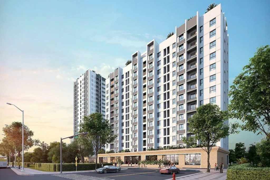 Tòa nhà chung cư cao tầng khang trang với thiết kế ô cửa sổ thông thoáng bên cạnh con đường sạch đẹp, hình ảnh minh họa cho lời giải đáp nhà ở xã hội có sổ hồng không