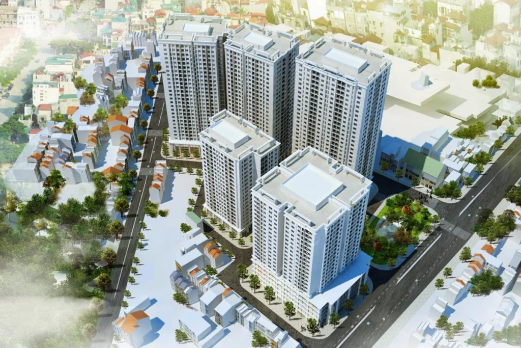 Phối cảnh tổng thể từ trên cao của một dự án chung cư cao tầng hiện đại với 5 block tòa nhà sơn màu trắng, đan xen xung quanh là các khu nhà phố thấp tầng mái ngói đỏ