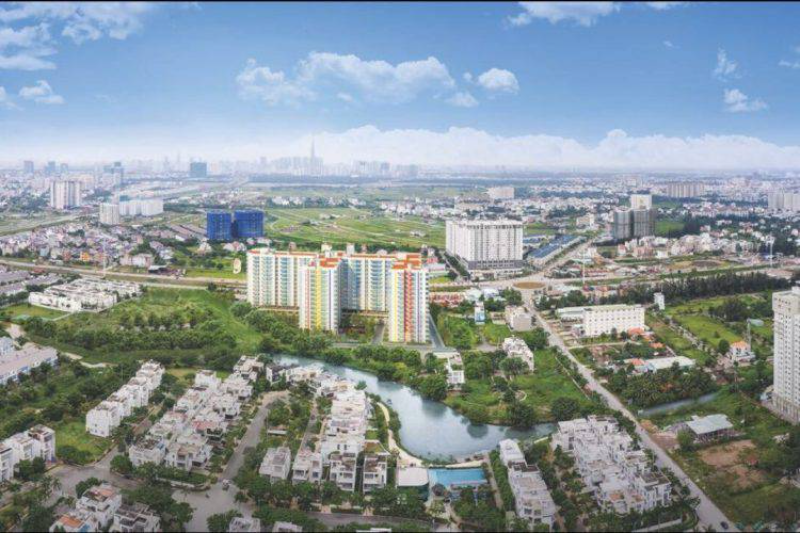 Góc nhìn từ trên cao khu căn hộ HausBelo Quận 9 nằm gần dòng sông uốn lượn và quần thể khu biệt thự thấp tầng sang trọng