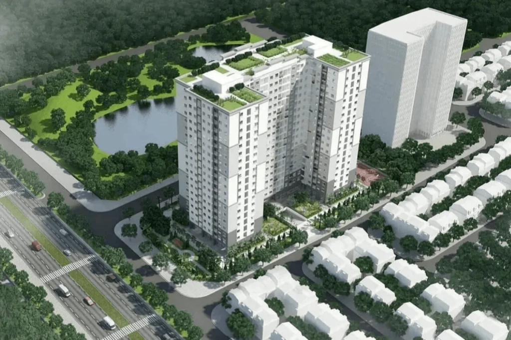 Phối cảnh dựng hình góc nghiêng từ trên cao, hiển thị một tòa chung cư đơn khối hình chữ L sơn màu trắng xám trang nhã, phần mái tòa nhà phủ xanh bằng các lối đi bộ và tiểu cảnh sân vườn
