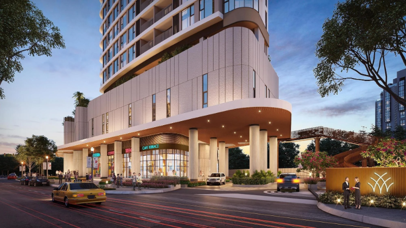 Phối cảnh mặt tiền khối đế dự án Thảo Điền Green Quận 2 với các cửa hàng shophouse kinh doanh cafe, sảnh đón có mái che cong và đường nội khu vào buổi tối