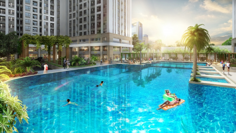 Tiện ích hồ bơi tràn bờ diện tích lớn nội khu RichStar Tân Phú với làn nước xanh biếc, ghế tắm nắng và hàng cây xanh mát